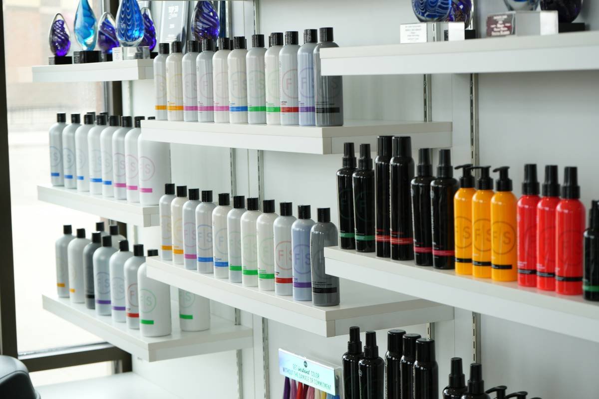 Comparison chart showing polymer content and hold strength across 5 popular lightweight hair sprays